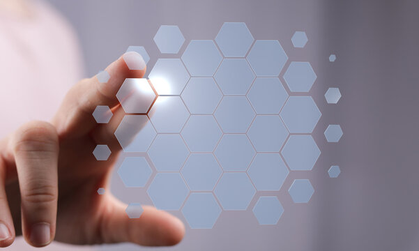 Hand reaching towards digital hexagon network, modern technology abstract concept, connection.