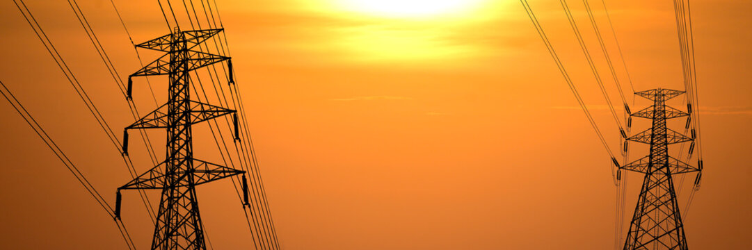 Power Grid at Dusk: Striking silhouette of power pylons against the radiant sunset, the intricate infrastructure that powers our modern world. - Powered by Adobe