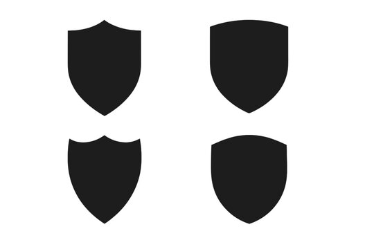 Four black heraldic shield shapes isolated on white background