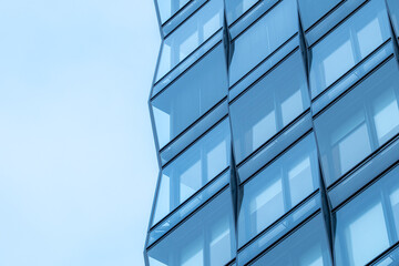 Architecture skyline expressing contemporary highrise geometry with soft clouds and minimalism, featuring wide copy space that enhances a clean urban detail structure