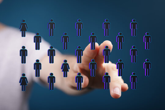 Hand pointing at digital people icons representing connection, network, teamwork, communication, and social media concepts. Business and technol