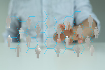 Concept of global connection and digital networking. Hand interacts with network of people. Communication and teamwork.