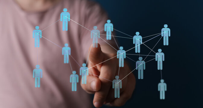 Hand touching digital human network, representing teamwork, communication, and connectivity in business and tec