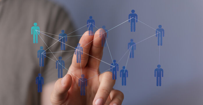 Hand reaching towards a digital human network. Teamwork and communication concept. Network of people connected with each other. Business, intern - Powered by Adobe