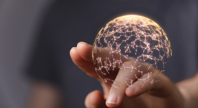 Hand holding a glowing digital network globe, representing connection, data, technology, and futuristic concepts. Perfect for business, innovati