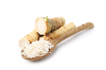 Grated horseradish and roots isolated on white