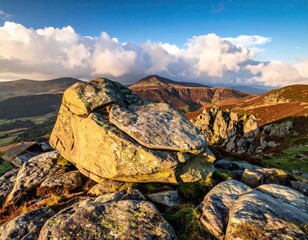 Golden Rocks and Mountain Landscape Under a Cloudy Sky