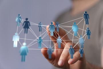 Abstract network of people connected by lines as a concept of teamwork and collaboration. Hand...