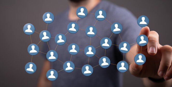 Concept of networking, connectivity, social media. Hand touching digital people icons. Business team, partnersh - Powered by Adobe