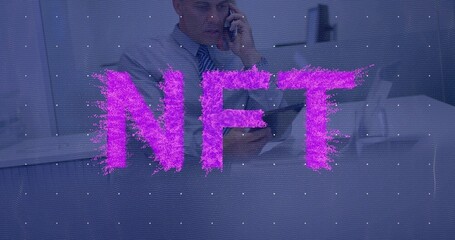 Speaking mature man holding phone, in suit and tie at desk, with magenta NFT grid overlay