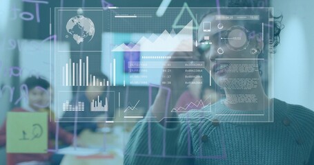 Writing woman in green knit sketching on glass board at office, digital dashboard, copy space