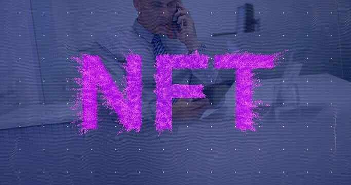 Speaking mature man holding phone, in suit and tie at desk, with magenta NFT grid overlay