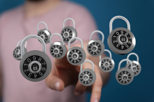 Image depicting digital security, a hand interacting with floating combination locks, emphasizing protection an