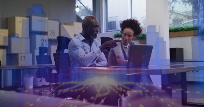 Pointing duo in blue shirt, grey blazer using laptop at office table boxes17,21,26 and data overlay