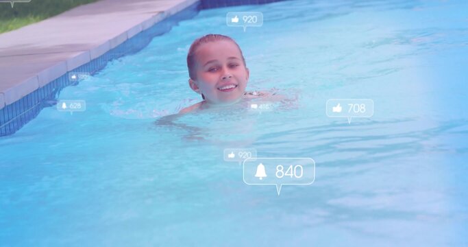 Smiling child swimmer with wet hair floating near pool edge, showing swimwear and notifications
