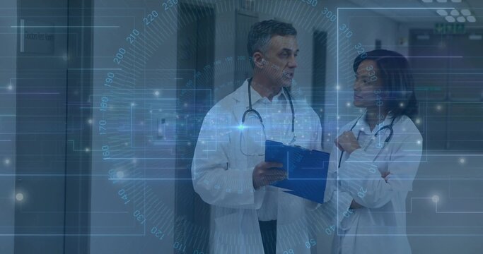 Consulting doctors wearing lab coats and stethoscopes in hospital corridor with blue folder and HUD