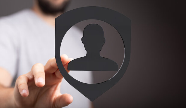 Person holding security shield icon, safeguarding personal data, privacy, safety, and online security. Data pro