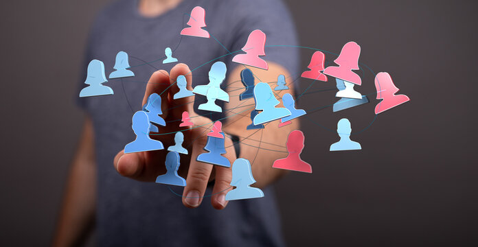 Concept of teamwork and communication using network technology. Hand pointing at interconnected human figures, digital representation of a netwo