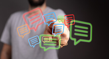 Hand interacts with messaging icons. Illustrates digital communication, online interaction, and modern connection in technology. Concept of conn