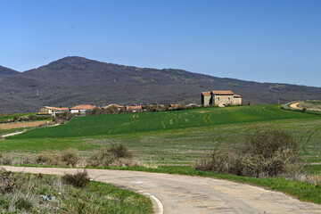 Obraz premium Scenic view of San Martin church in Matalbaniega with hills and countryside background