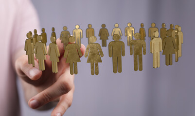 An abstract depiction of unity, connection, and community. Featuring a hand holding miniature human...