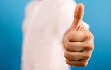 Image of a hand giving a thumbs up, representing agreement, approval, or a positive sentiment. Perfect for success, business, and support concep