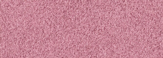 Full frame closeup of a soft pink fibrous texture. Seamless background material for fabric, textile, or industrial scrub pad concept.