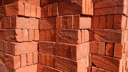 Brick stacks, Bricks pile with their terra cotta color texture background