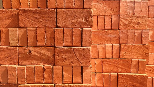Brick stacks, Bricks pile with their terra cotta color texture background