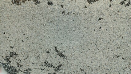 Close-up of rough asphalt surface texture background