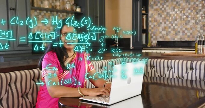 Woman in pink saree typing on laptop, causing teal chemistry formulas filling screen while teaching