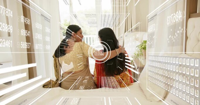 Mother and daughter sitting on bed, turning heads causing medical HUD scanning numbers, embracing