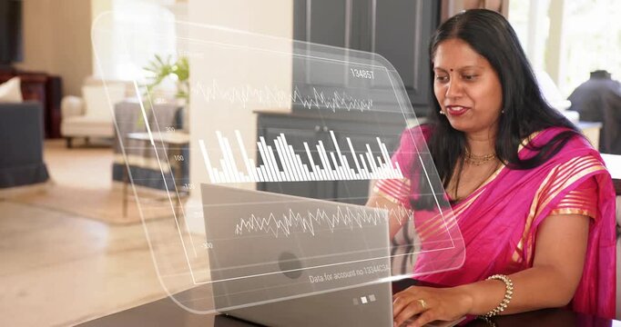 Woman home speaking and typing on laptop, activating holographic charts and reviewing finance data - Powered by Adobe