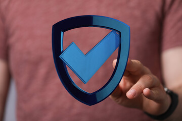 Abstract image representing data protection, security and verification. Hand holding digital shield...