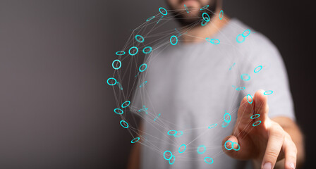 Close up of a man's hand touching a glowing digital network interface. Illustrating data connection, innovation and technology, concepts and ide