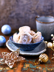 Traditional christmas cookies in a bowl on a wooden background. Soft focus.	