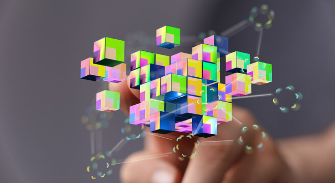 Digitally rendered image depicting data cubes in a user's hand, representing technology and data. Concepts like