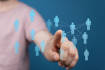 Hand reaching towards a digital network, representing concepts like connection, communication, and social inter
