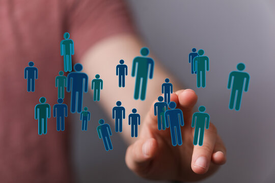 Hand interacting with digital people icons, teamwork concept, connection, networking, social media, human resou - Powered by Adobe