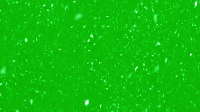 Dynamic falling snow effect with green screen background for winter video production and holiday animations, creating a magical atmosphere for festive projects and seasonal storytelling.
