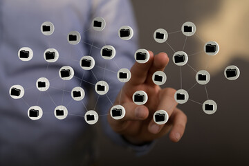 Digitally connected data network concept showing folders interconnected through a hand, representing cloud data