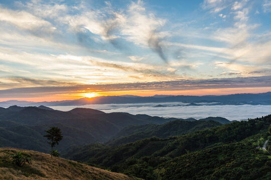 Beautiful Landscape of mountain layer in morning sun ray and winter fog at Doi Laem, Mea Ai in Chiangmai, Thailand 
