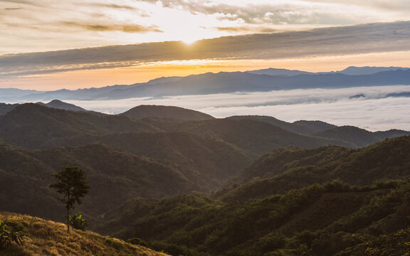 Beautiful Landscape of mountain layer in morning sun ray and winter fog at Doi Laem, Mea Ai in Chiangmai, Thailand 