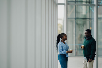 Black colleagues having a coffee break conversation