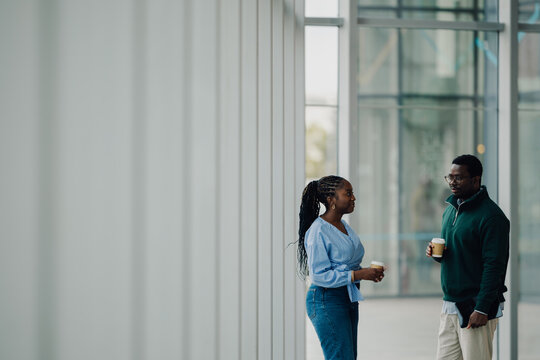 Black colleagues having a coffee break conversation