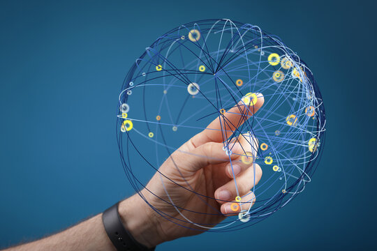 A hand touching a network globe, representing global connectivity, digital transformation, and the future of technology and networkin - Powered by Adobe