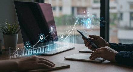 Dynamic digital analysis of business growth and innovation displayed on modern laptop screen with user interacting via smartphone