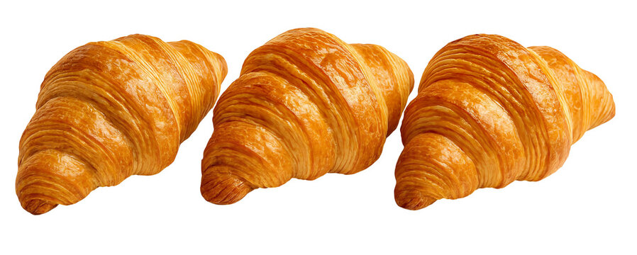 Horizontal row of three golden flaky French croissants