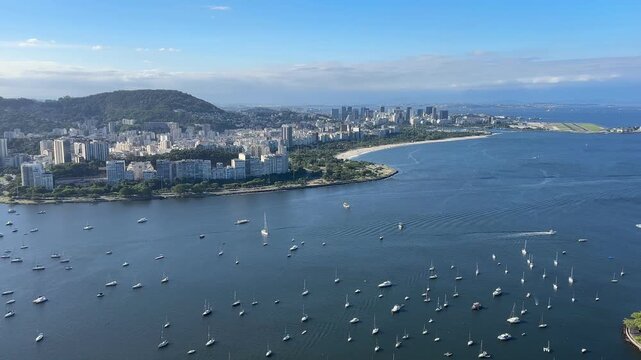 Panoramic view of Rio de Janeiro , showing Flamengo Beach, Aterro do Flamengo, Guanabara Bay, Santos Dumont Airport, Botafogo, Urca,  under partly cloudy sky.