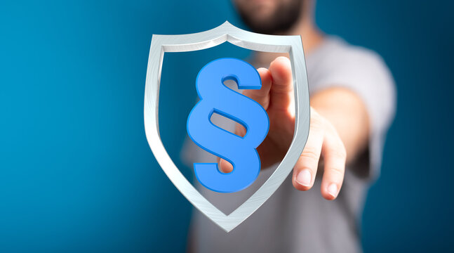 A person protecting a paragraph symbol. Law and protection concept, symbolizing legal compliance, regulations and justice. Concept of security,